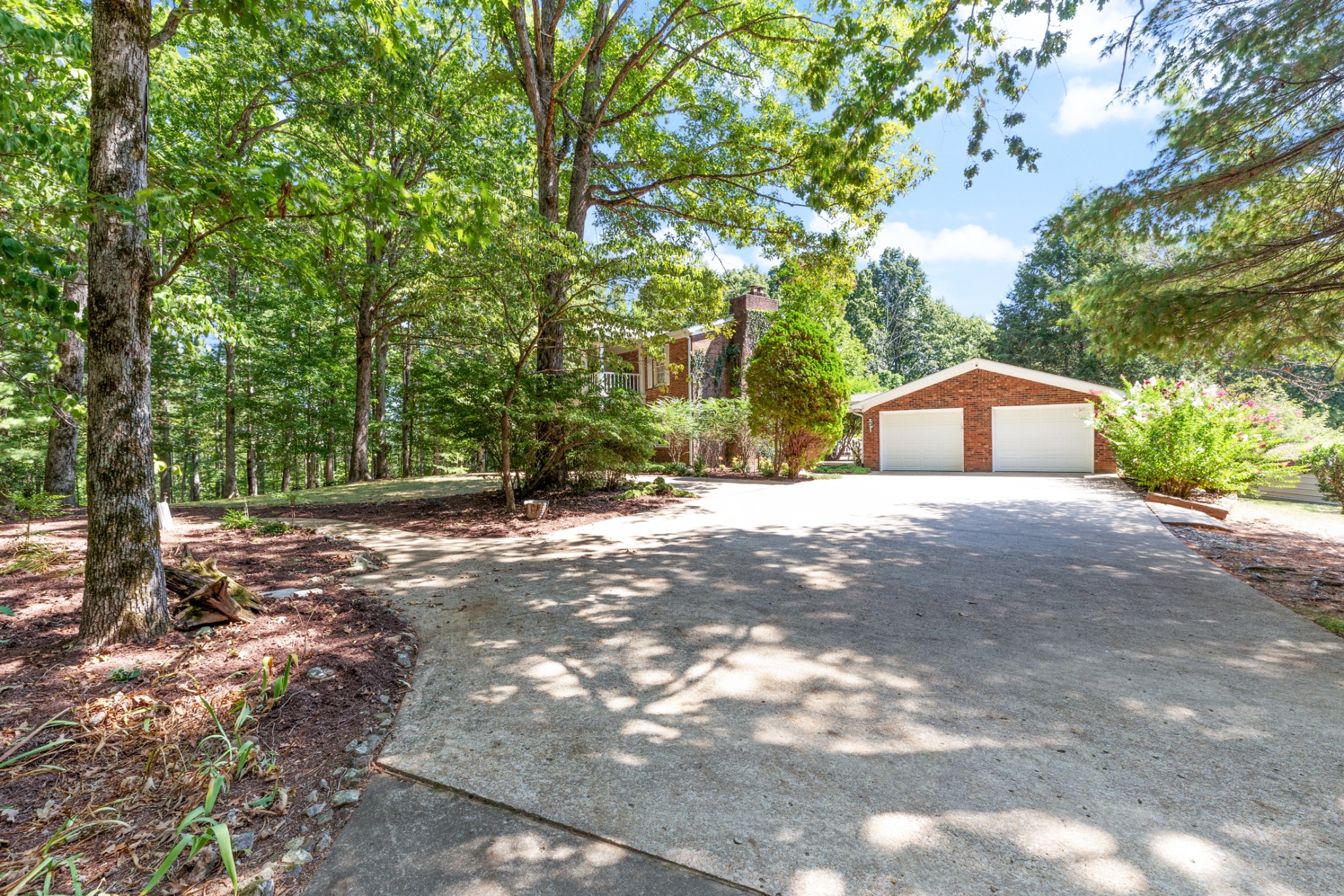 7422 Indian Creek Road McEwen, TN 37101 - Photo 11 of 71 a house with trees in front of it