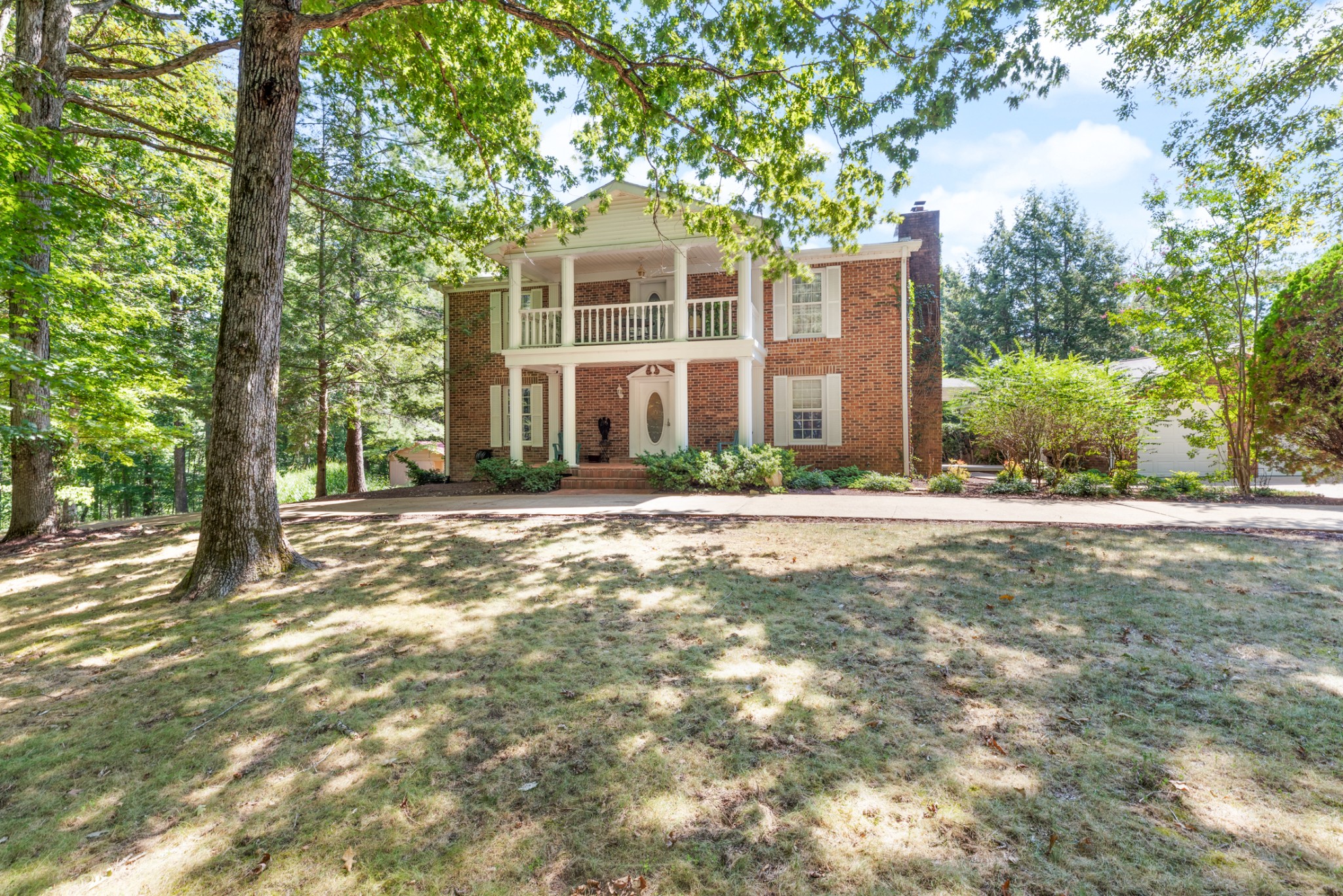 7422 Indian Creek Road McEwen, TN 37101 - Photo 2 of 71 a front view of a house with a garden