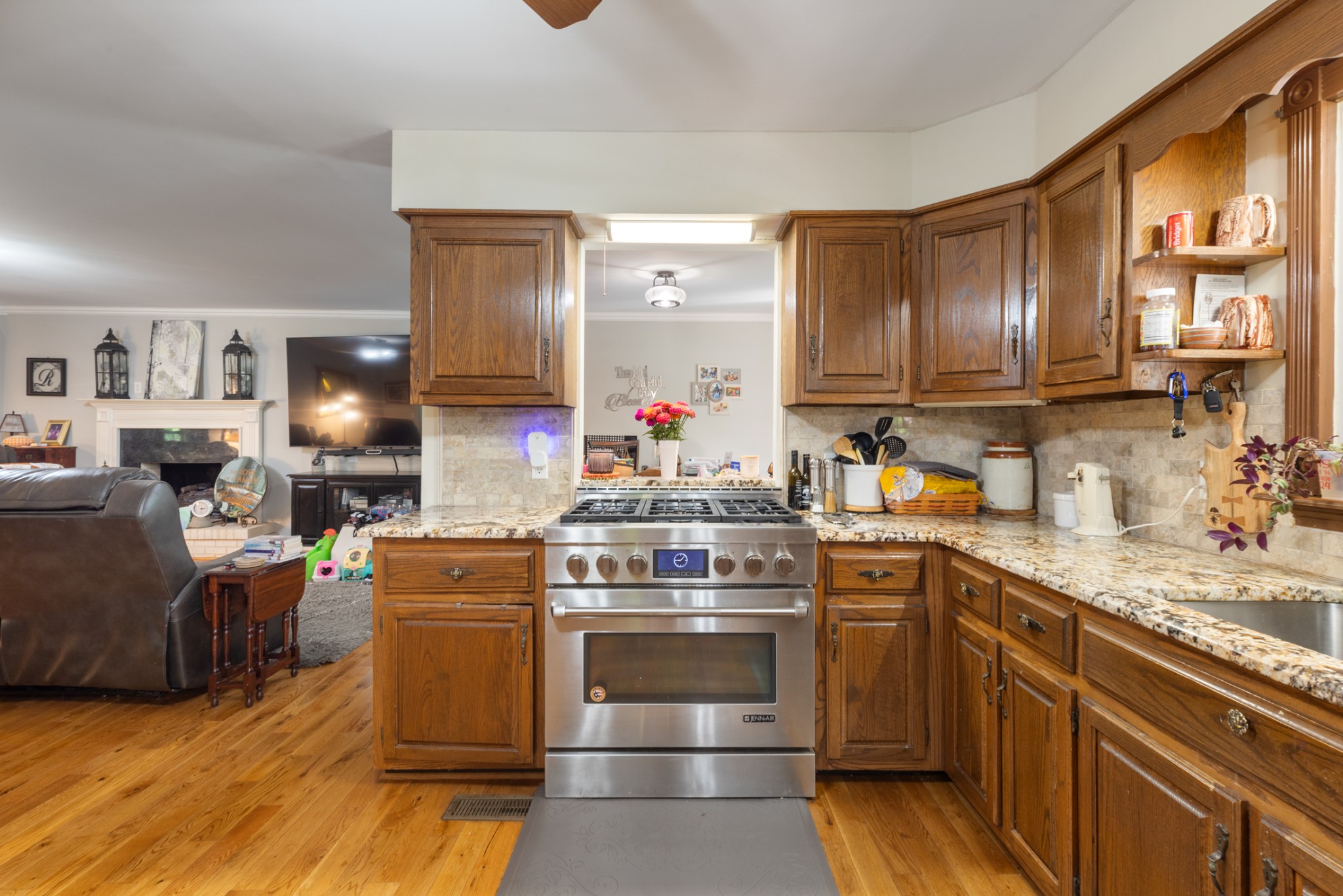 7422 Indian Creek Road McEwen, TN 37101 - Photo 25 of 71 a kitchen with stainless steel appliances granite countertop a stove a sink dishwasher and a refrigerator