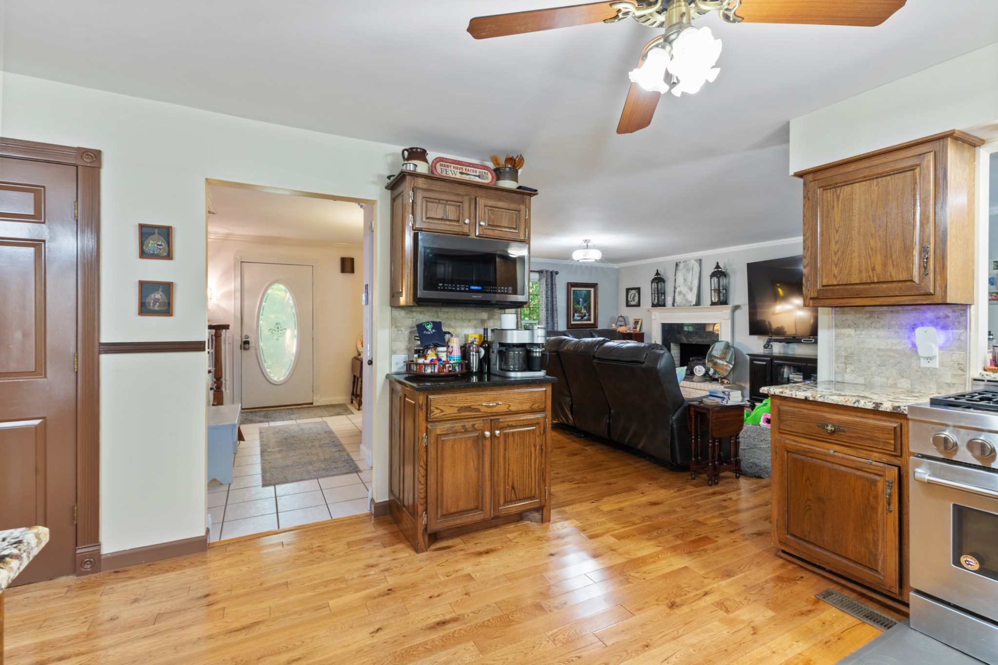 7422 Indian Creek Road McEwen, TN 37101 - Photo 27 of 71 a kitchen with stainless steel appliances granite countertop a refrigerator a stove top oven a sink and dishwasher
