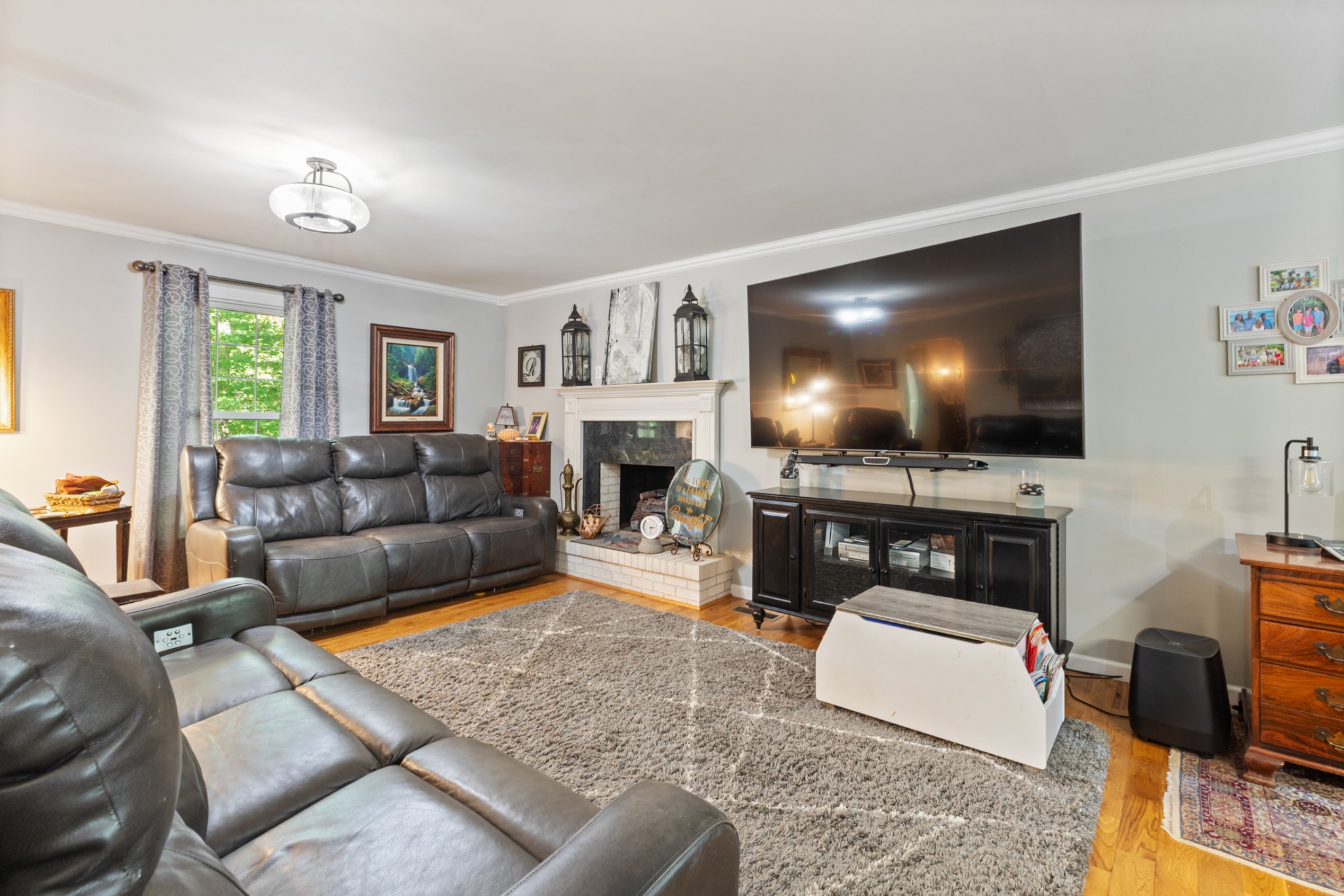 7422 Indian Creek Road McEwen, TN 37101 - Photo 30 of 71 a living room with furniture and a flat screen tv