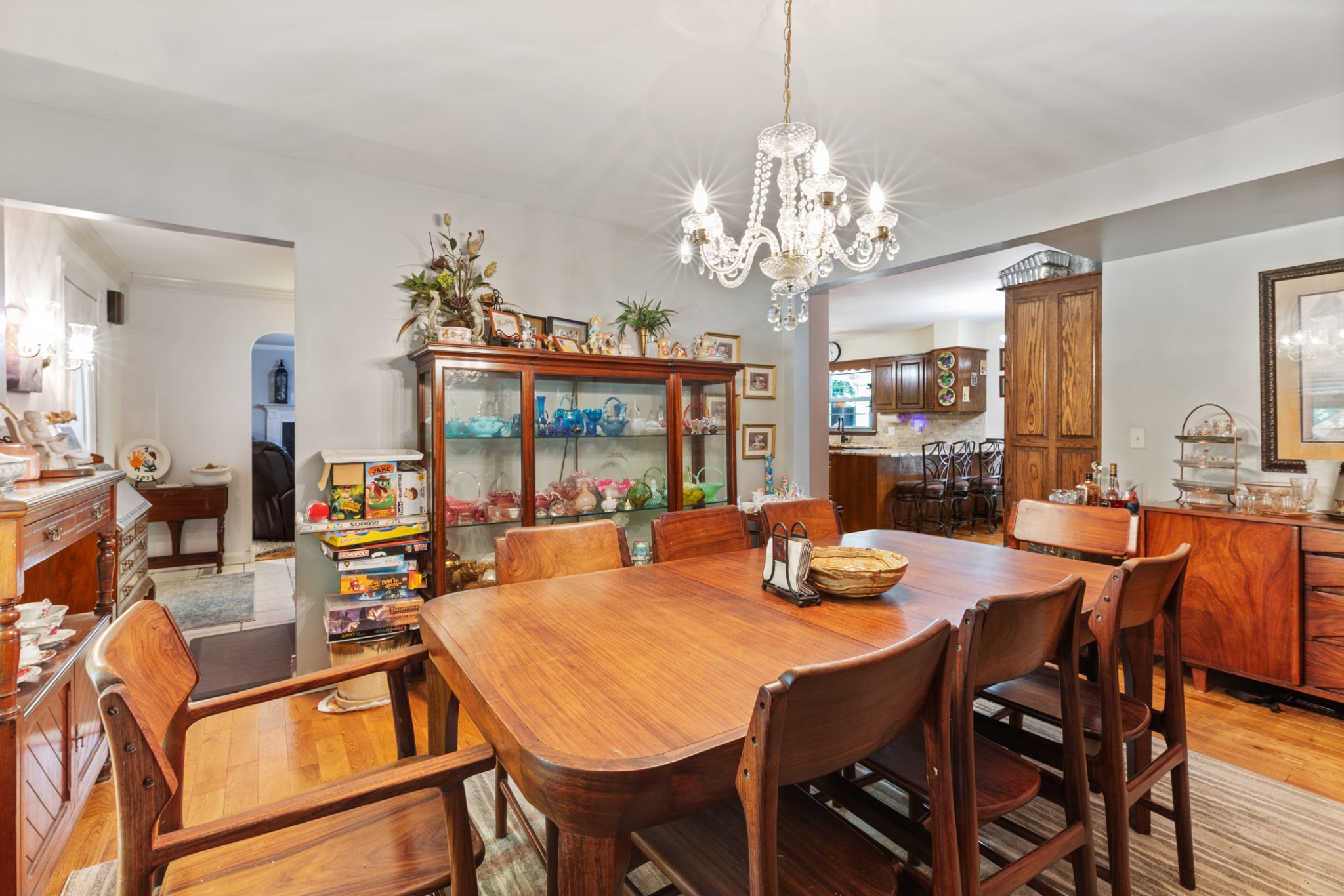 7422 Indian Creek Road McEwen, TN 37101 - Photo 33 of 71 a view of a dining room with furniture a chandelier and wooden floor