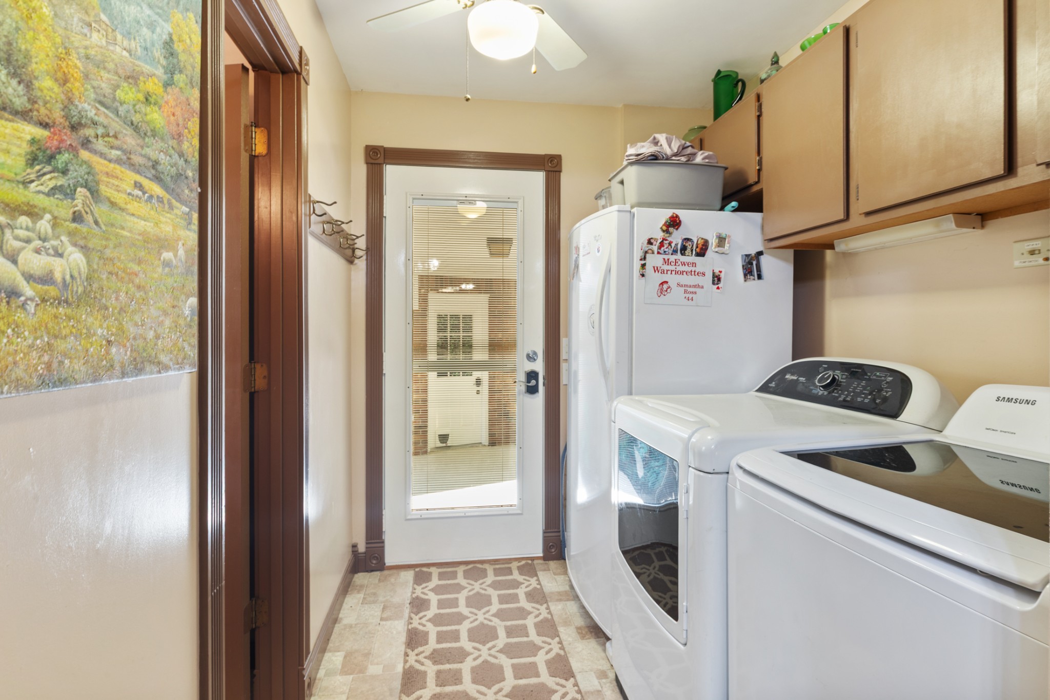 7422 Indian Creek Road McEwen, TN 37101 - Photo 34 of 71 a view of washer and dryer with kitchen in the background