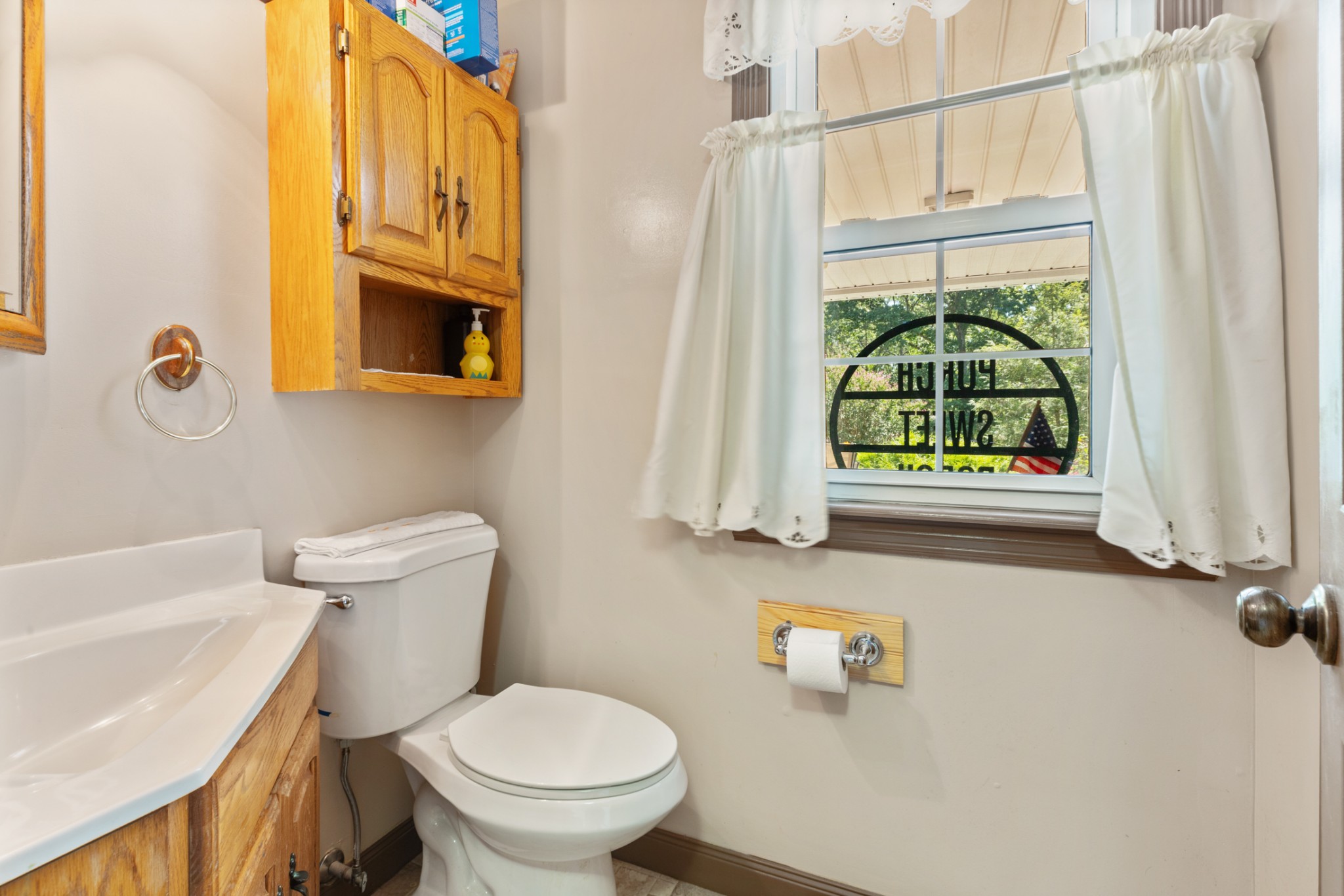 7422 Indian Creek Road McEwen, TN 37101 - Photo 35 of 71 a bathroom with a toilet a sink and a window