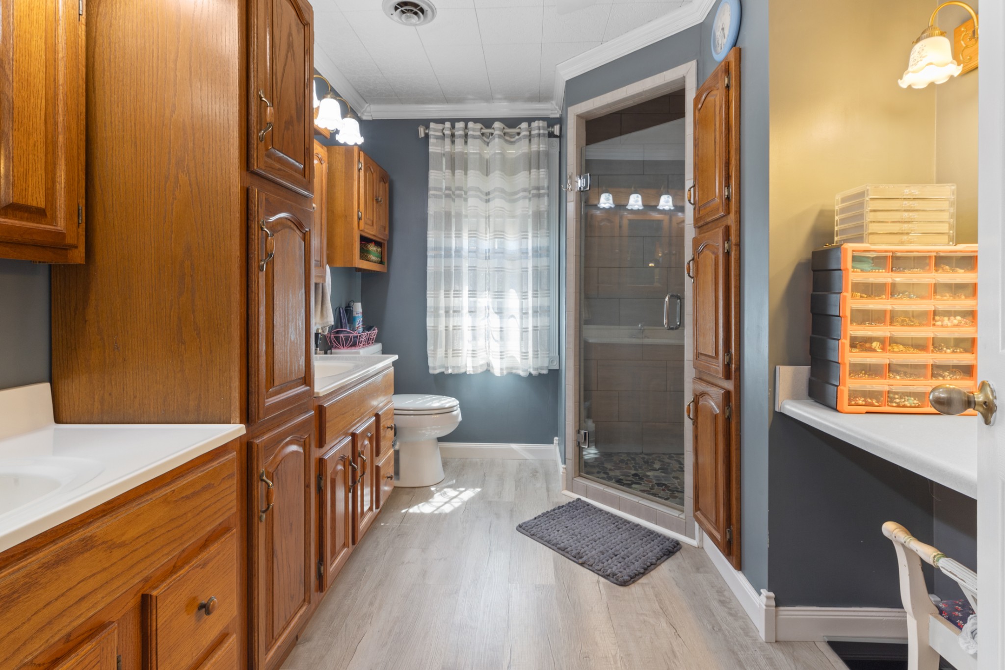 7422 Indian Creek Road McEwen, TN 37101 - Photo 48 of 71 a bathroom with a double vanity sink toilet and shower