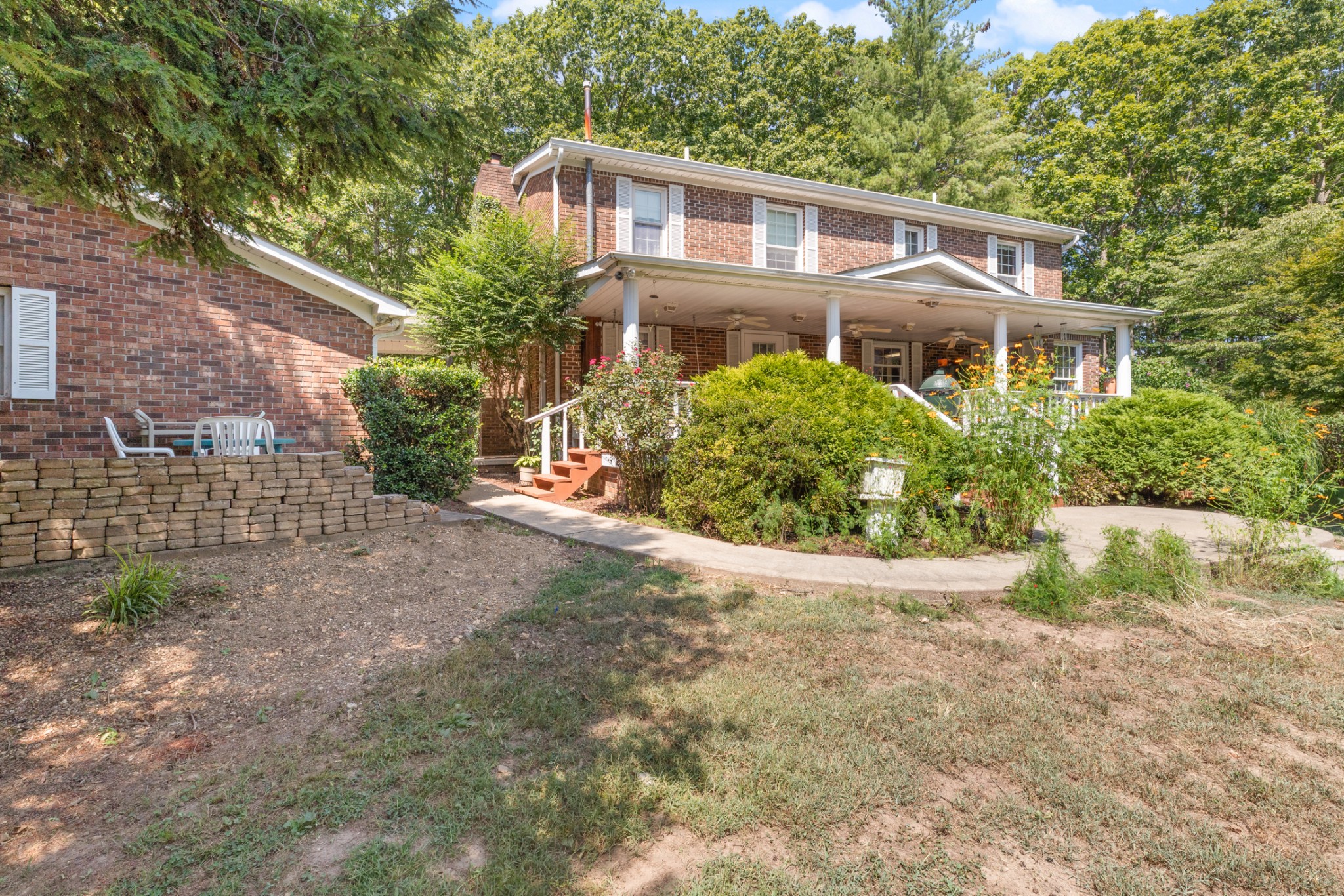 7422 Indian Creek Road McEwen, TN 37101 - Photo 63 of 71 a front view of a house with a yard and potted plants