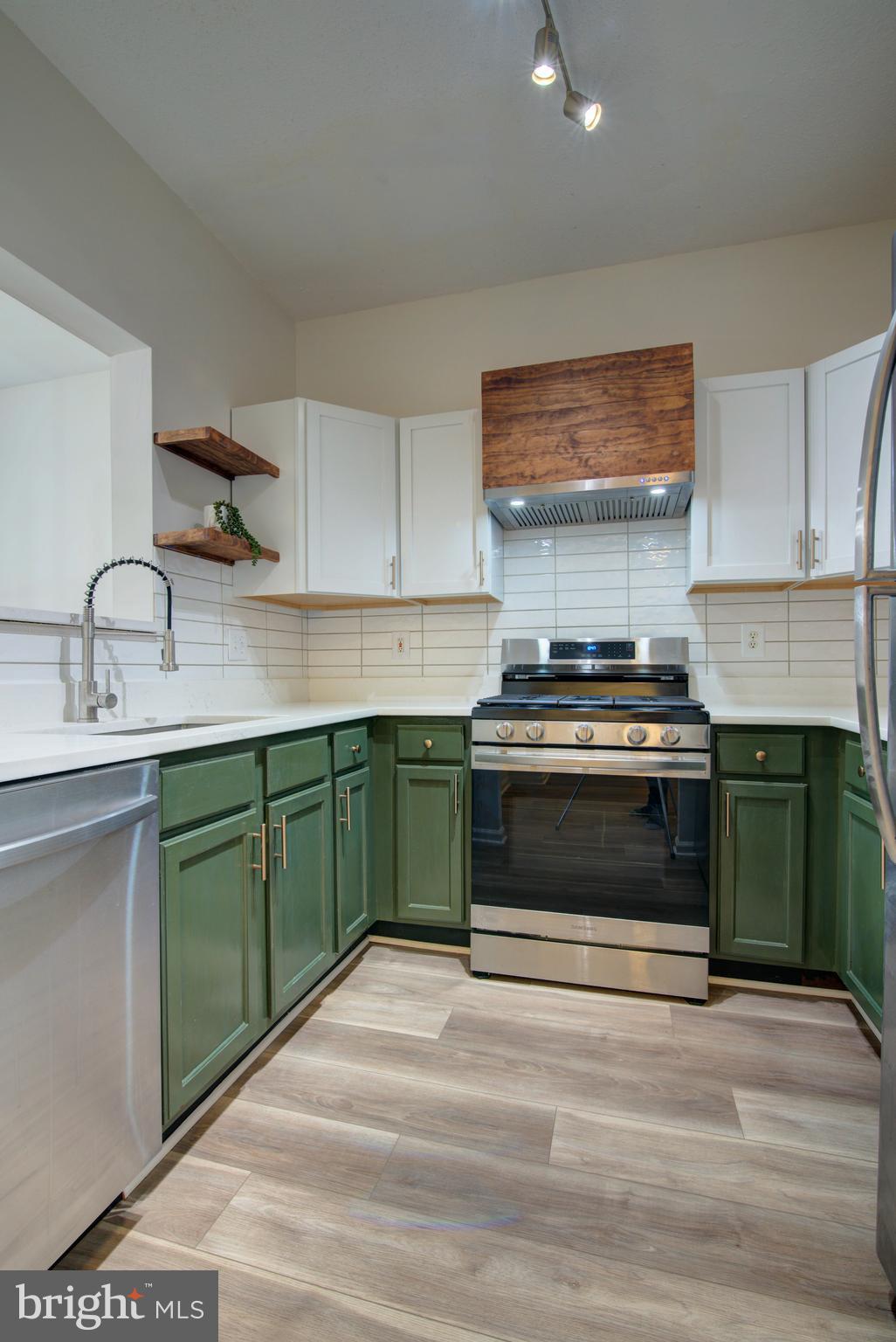 1708 Lake Shore Crest Drive Reston, VA 20190 - Photo 5 of 25 Kitchen with plenty of cabinets & tile backsplash