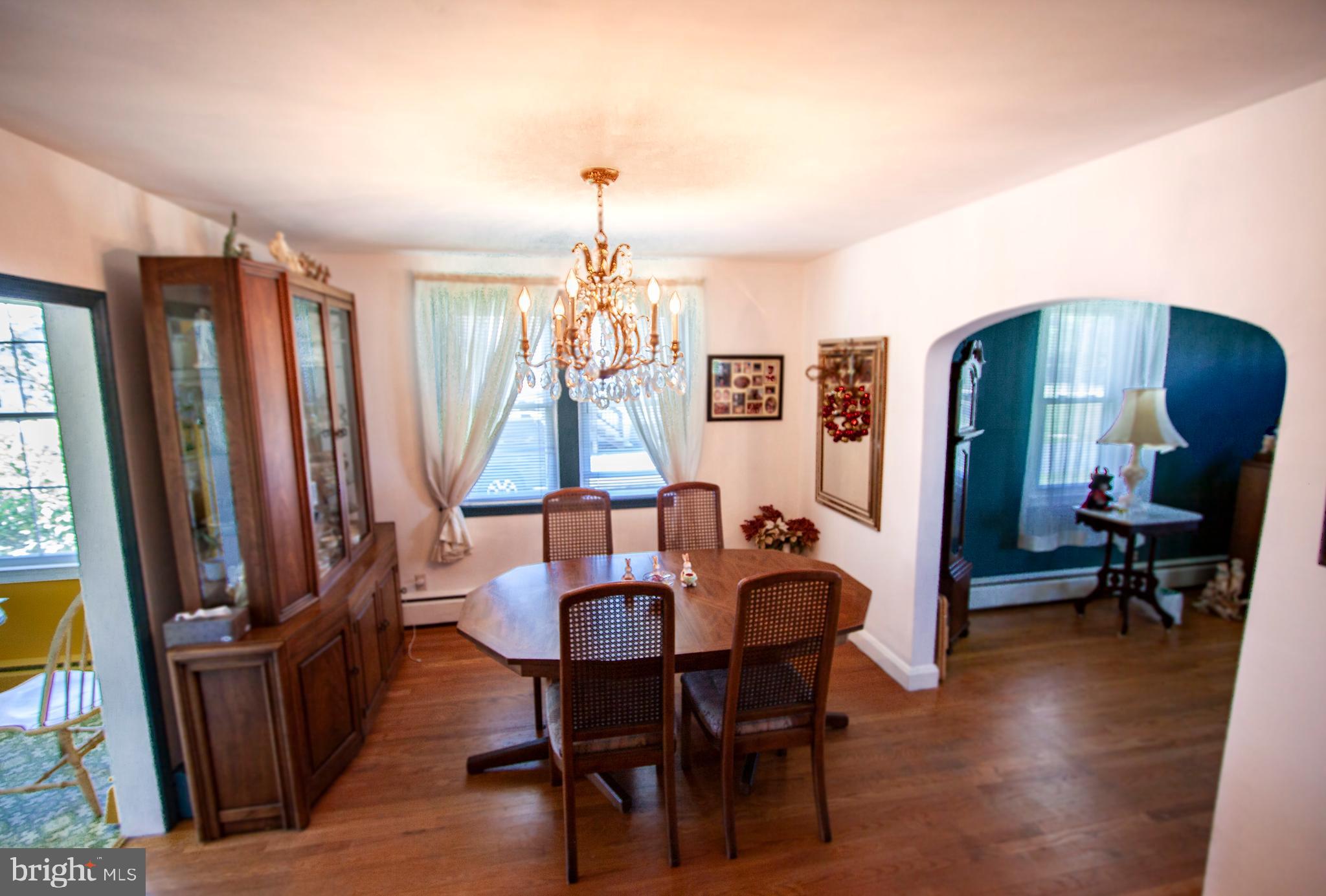 4703 Forge Road Perry Hall, MD 21128 - Photo 27 of 47 a view of a dining room with furniture window and wooden floor