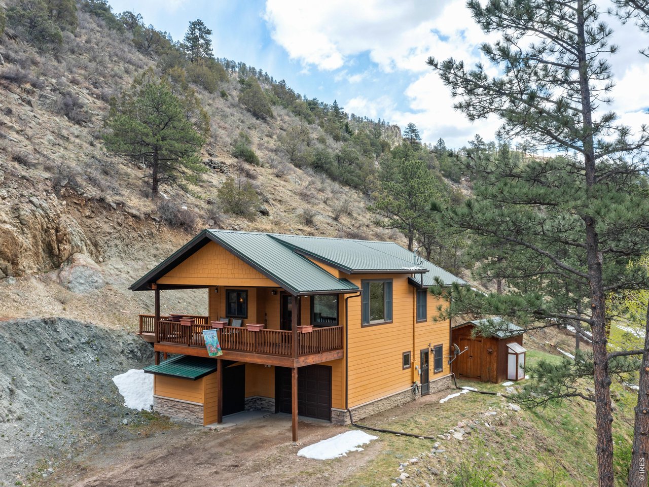 1002 Streamside Drive Drake, CO 80515 - Photo 3 of 37 a front view of a house with garden