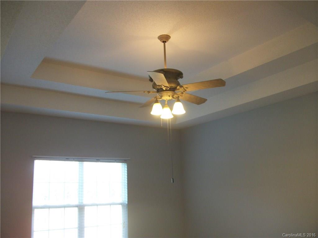 2118 Doster Road, Unit 1 Monroe, NC 28112 - Photo 12 of 24 a light fixture a chandelier fan and windows