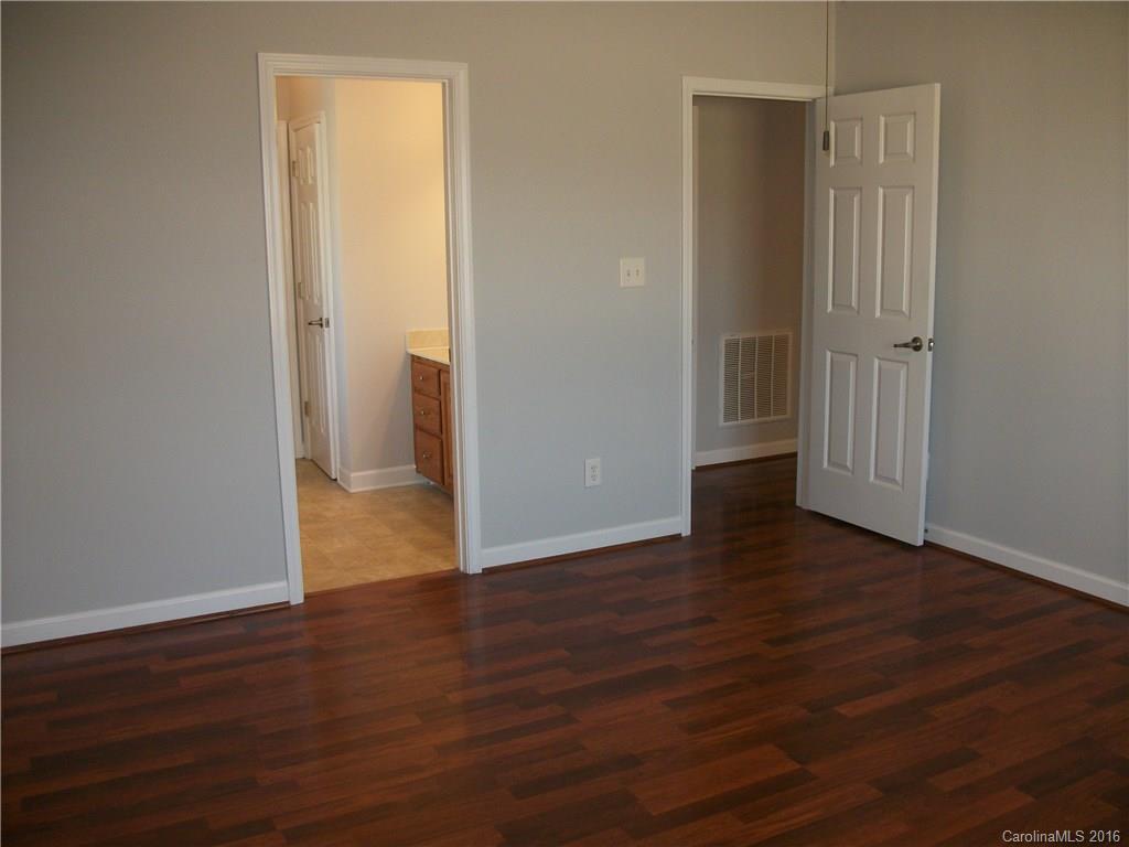 2118 Doster Road, Unit 1 Monroe, NC 28112 - Photo 13 of 24 an empty room with wooden floor and closet