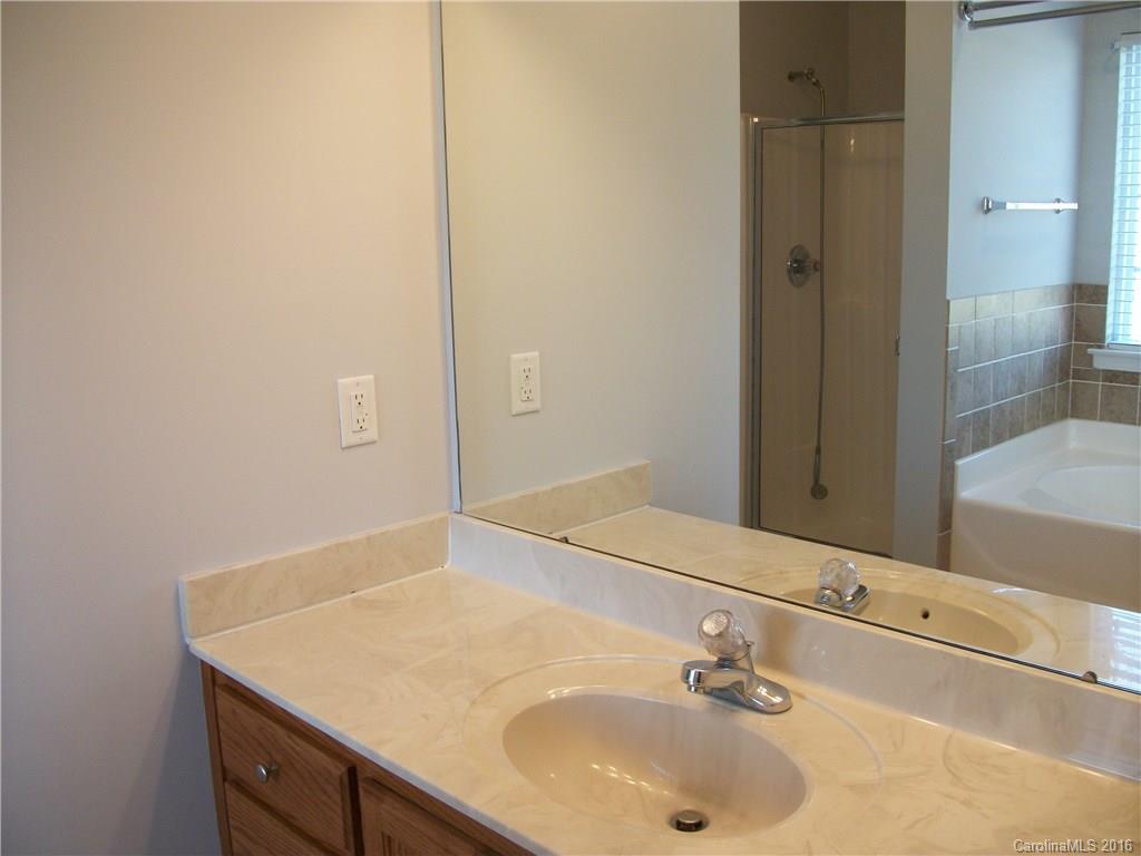2118 Doster Road, Unit 1 Monroe, NC 28112 - Photo 14 of 24 a bathroom with a sink and a mirror