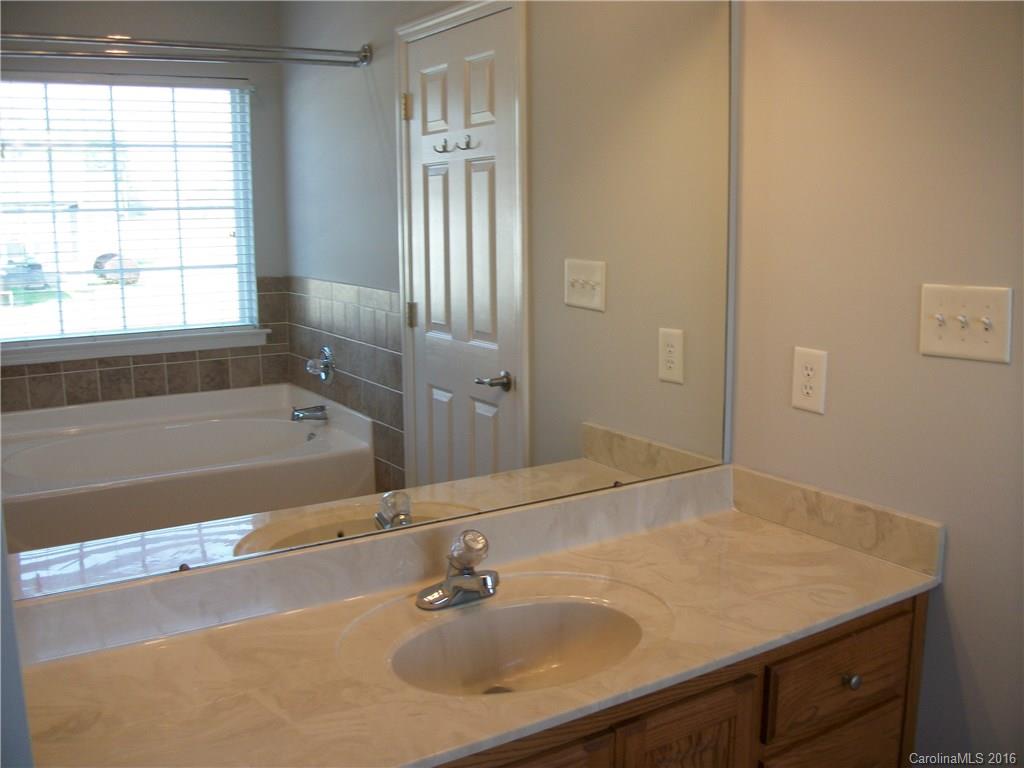 2118 Doster Road, Unit 1 Monroe, NC 28112 - Photo 15 of 24 a bathroom with a sink and a bathtub