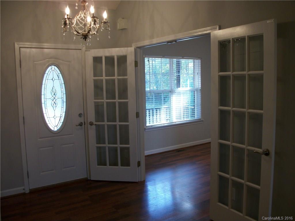 2118 Doster Road, Unit 1 Monroe, NC 28112 - Photo 4 of 24 an empty room with wooden floor and a window