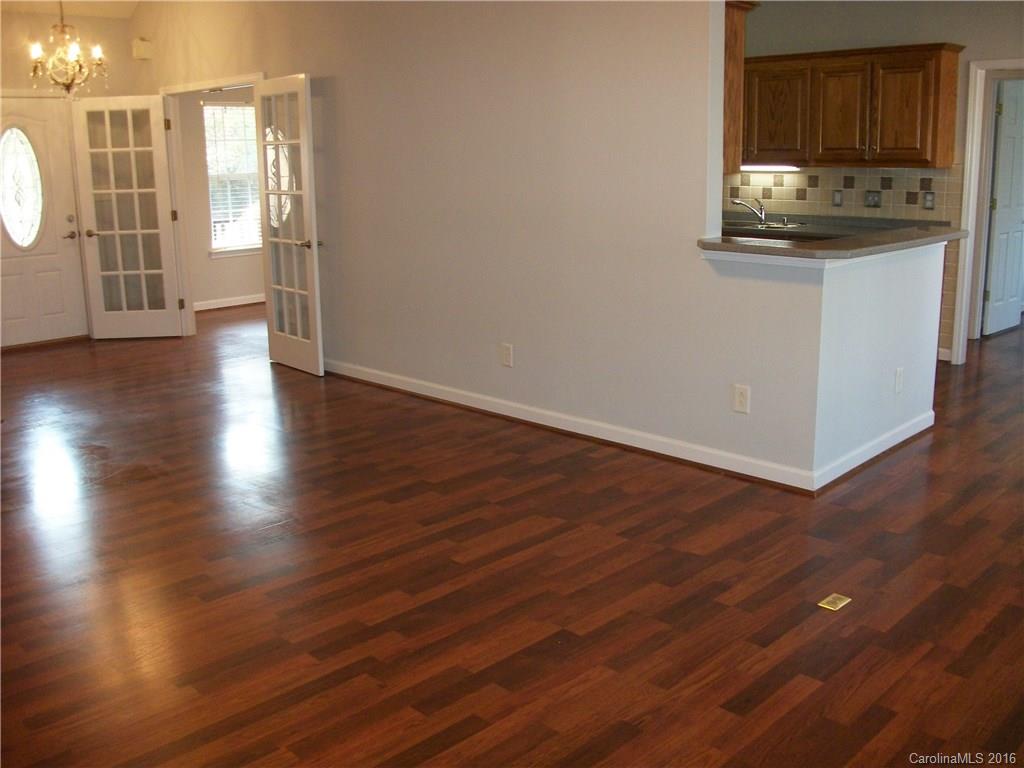 2118 Doster Road, Unit 1 Monroe, NC 28112 - Photo 6 of 24 an empty room with wooden floor and windows