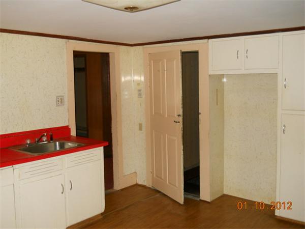 34 Morse Road Royalston, MA 01368 - Photo 6 of 15 a kitchen with a refrigerator and cabinets