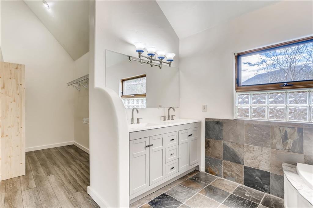 27 Rasor Court Keystone, CO 80435 - Photo 15 of 30 a spacious bathroom with double vanity and a mirror