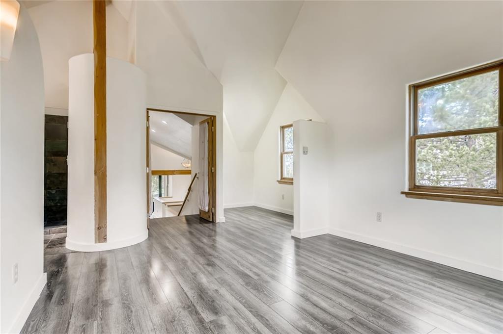 27 Rasor Court Keystone, CO 80435 - Photo 16 of 30 an empty room with wooden floor and windows