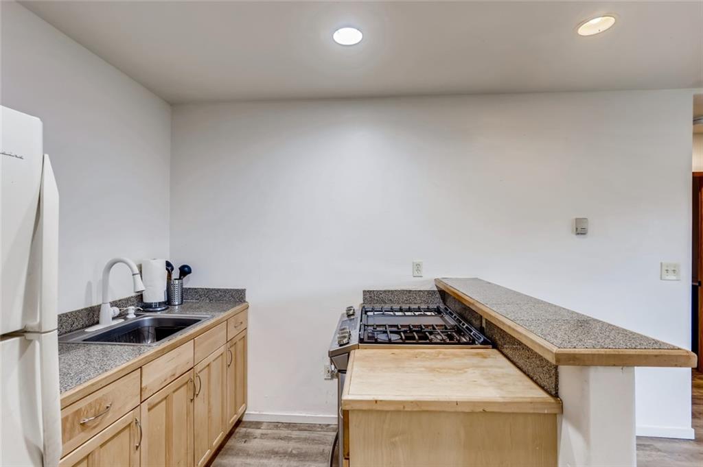 27 Rasor Court Keystone, CO 80435 - Photo 18 of 30 a kitchen that has a sink and a stove