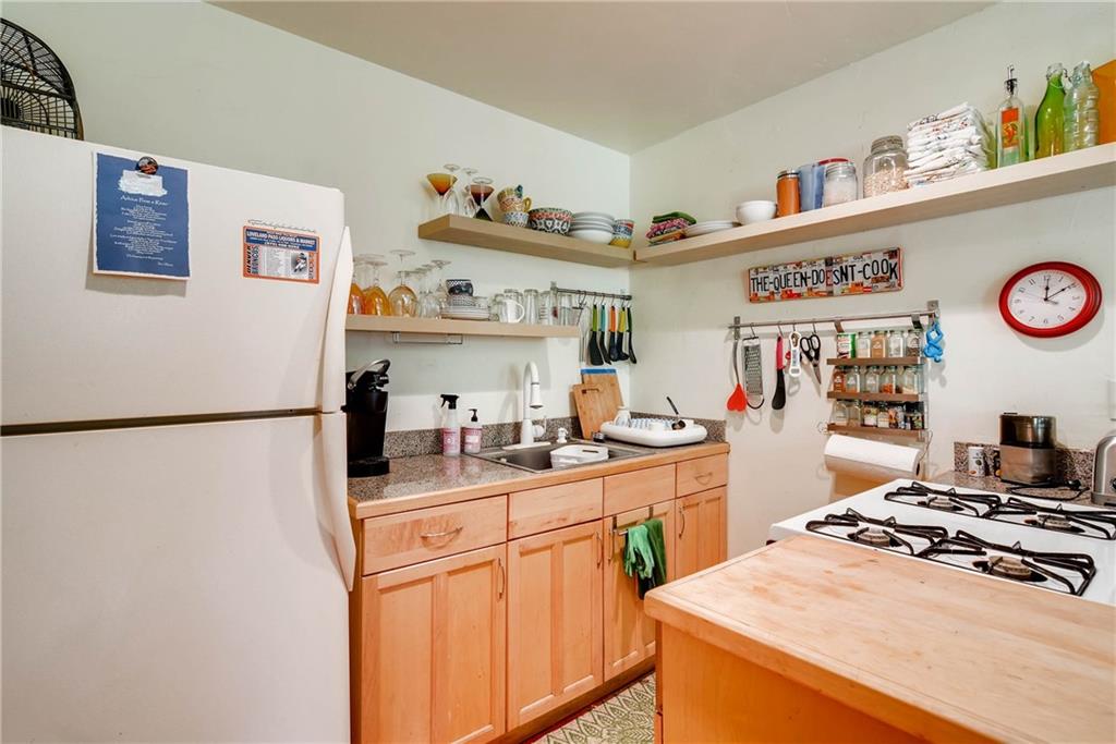 27 Rasor Court Keystone, CO 80435 - Photo 19 of 30 a kitchen with a refrigerator and a stove top oven