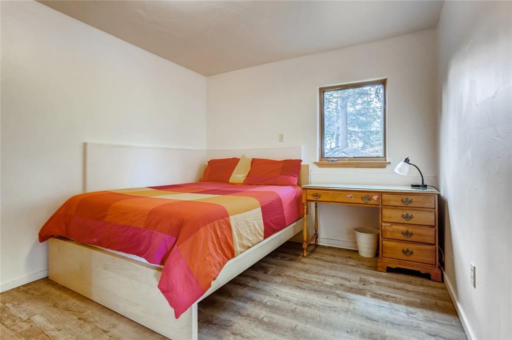 27 Rasor Court Keystone, CO 80435 - Photo 20 of 30 a bedroom with a bed and cabinet