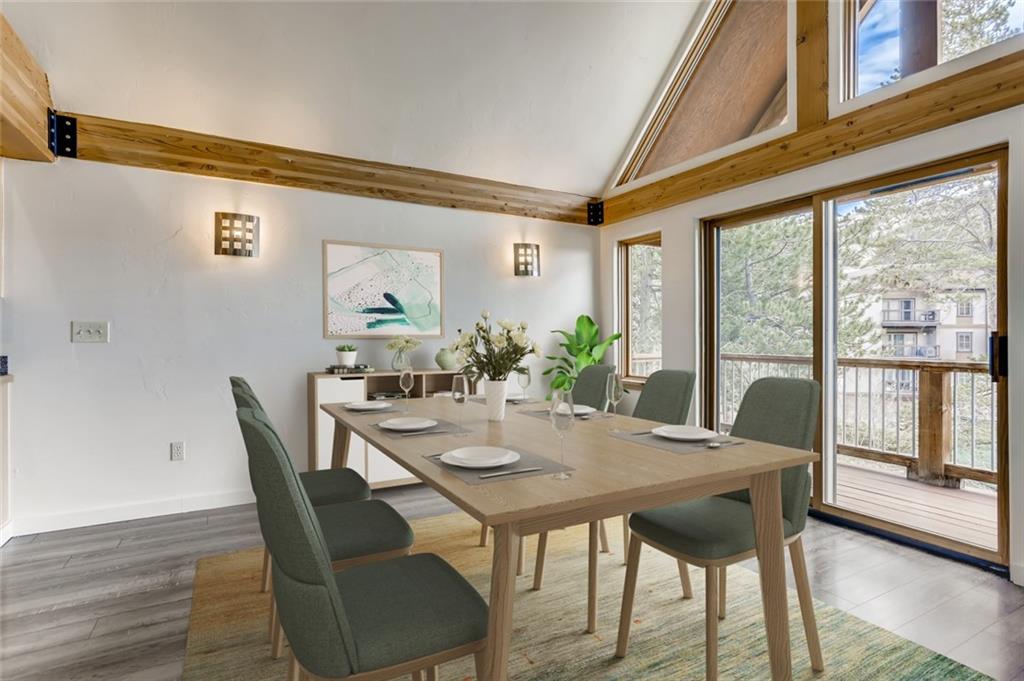 27 Rasor Court Keystone, CO 80435 - Photo 7 of 30 a view of a dining room with furniture window and wooden floor