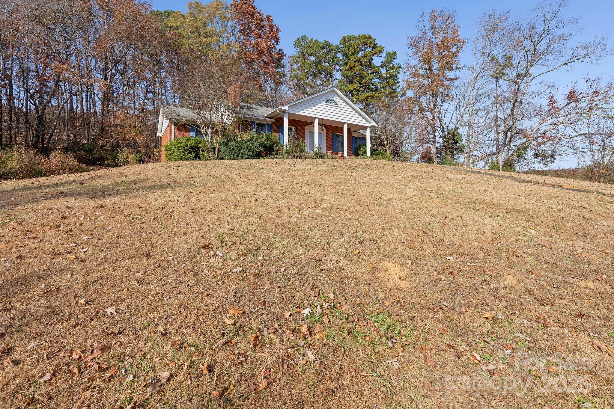 44372 Vickers Store Road Albemarle, NC 28001 - Photo 16 of 42 a view of a house with a yard