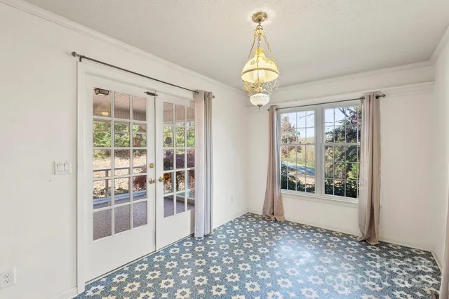 a view of a hallway with windows