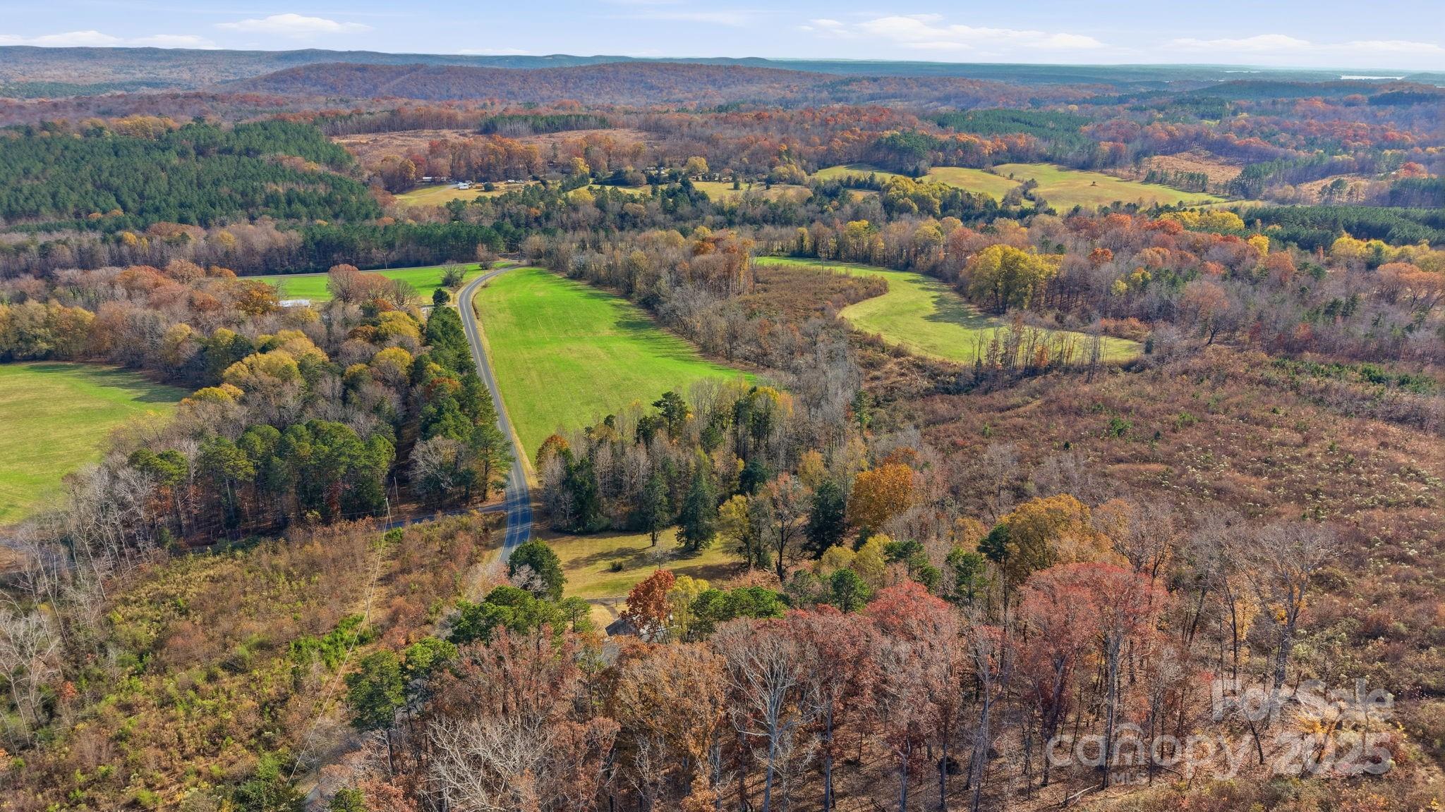 44372 Vickers Store Road Albemarle, NC 28001 - Photo 2 of 42 a view of a city with mountains in the background