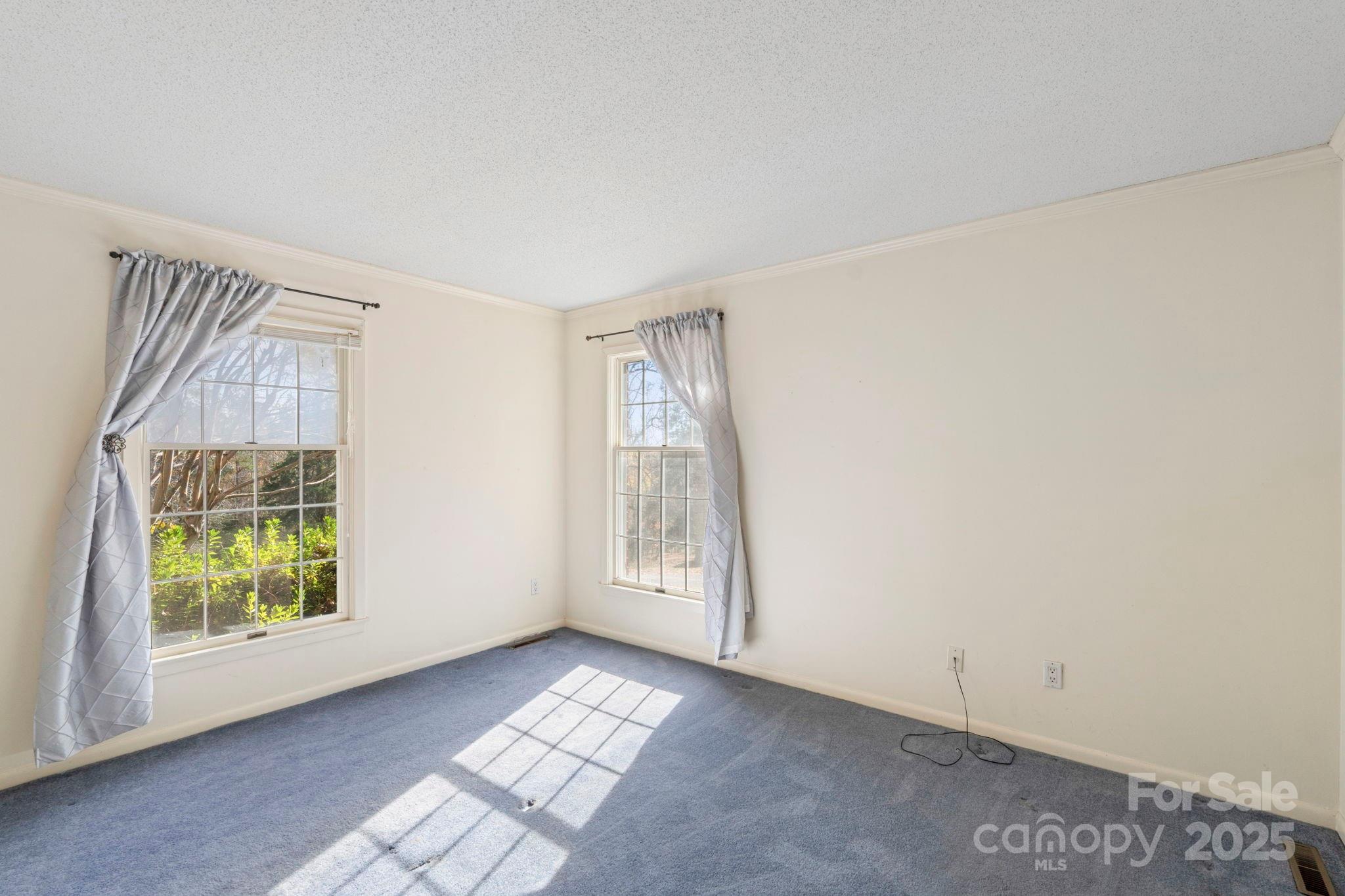 44372 Vickers Store Road Albemarle, NC 28001 - Photo 33 of 42 an empty room with windows