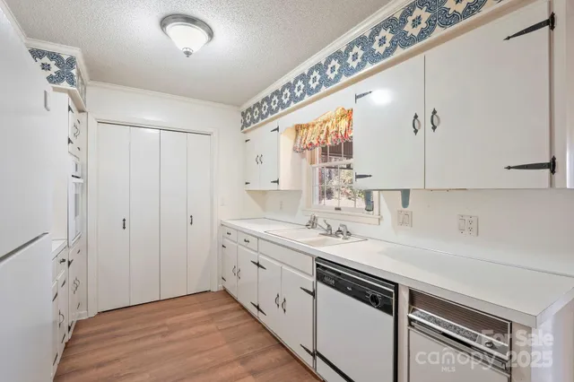 a view of a bathroom with a sink mirror and shower