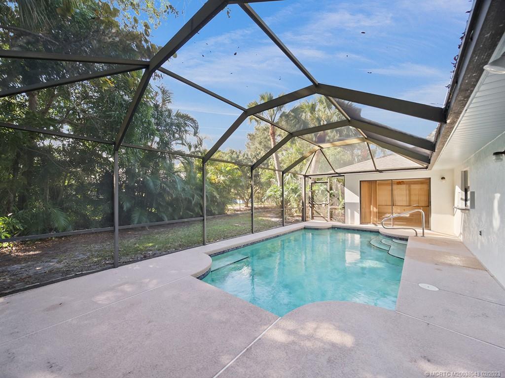 5 Copaire Road Stuart, FL 34996 - Photo 24 of 26 a view of a swimming pool with a backyard