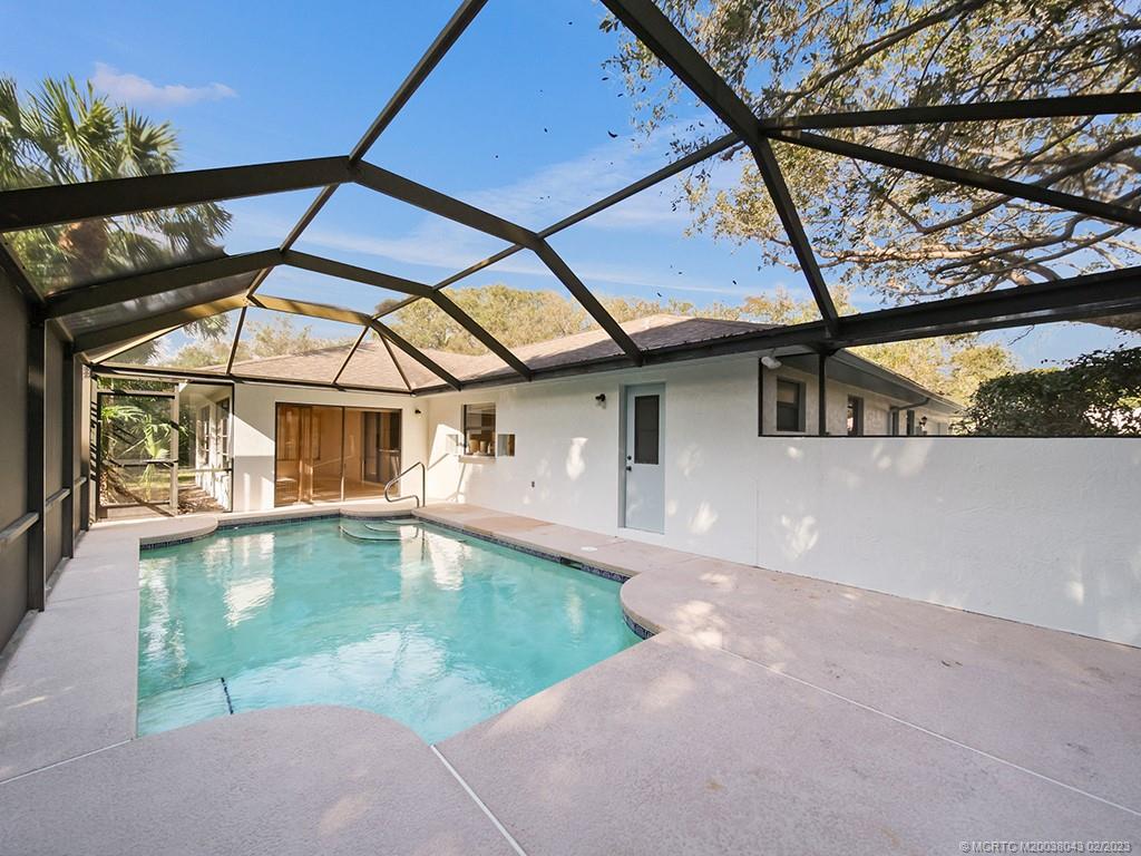 5 Copaire Road Stuart, FL 34996 - Photo 25 of 26 a view of a house with a swimming pool