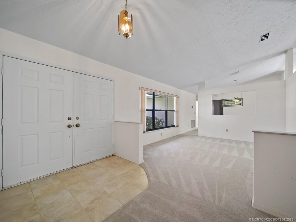 5 Copaire Road Stuart, FL 34996 - Photo 7 of 26 a view of a big room with closet and windows