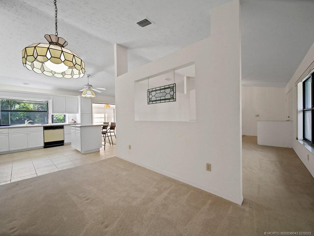 5 Copaire Road Stuart, FL 34996 - Photo 10 of 26 a view of a kitchen with a sink stove and a window