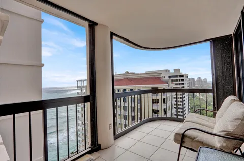 a view of a balcony with chairs