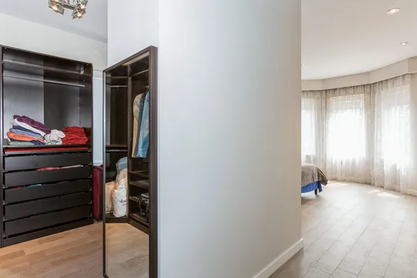 a view of an entryway with wooden floor