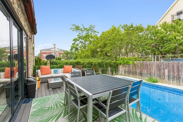 a balcony with furniture and a potted plant
