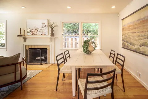a view of a dining room with furniture window and outside view