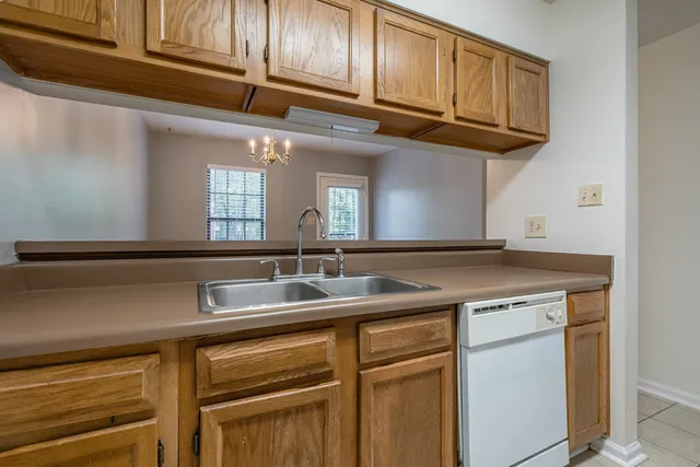 a kitchen with stainless steel appliances granite countertop a sink and cabinets
