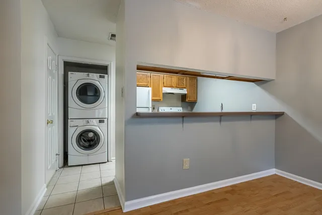 a view of a kitchen with washer and dryer