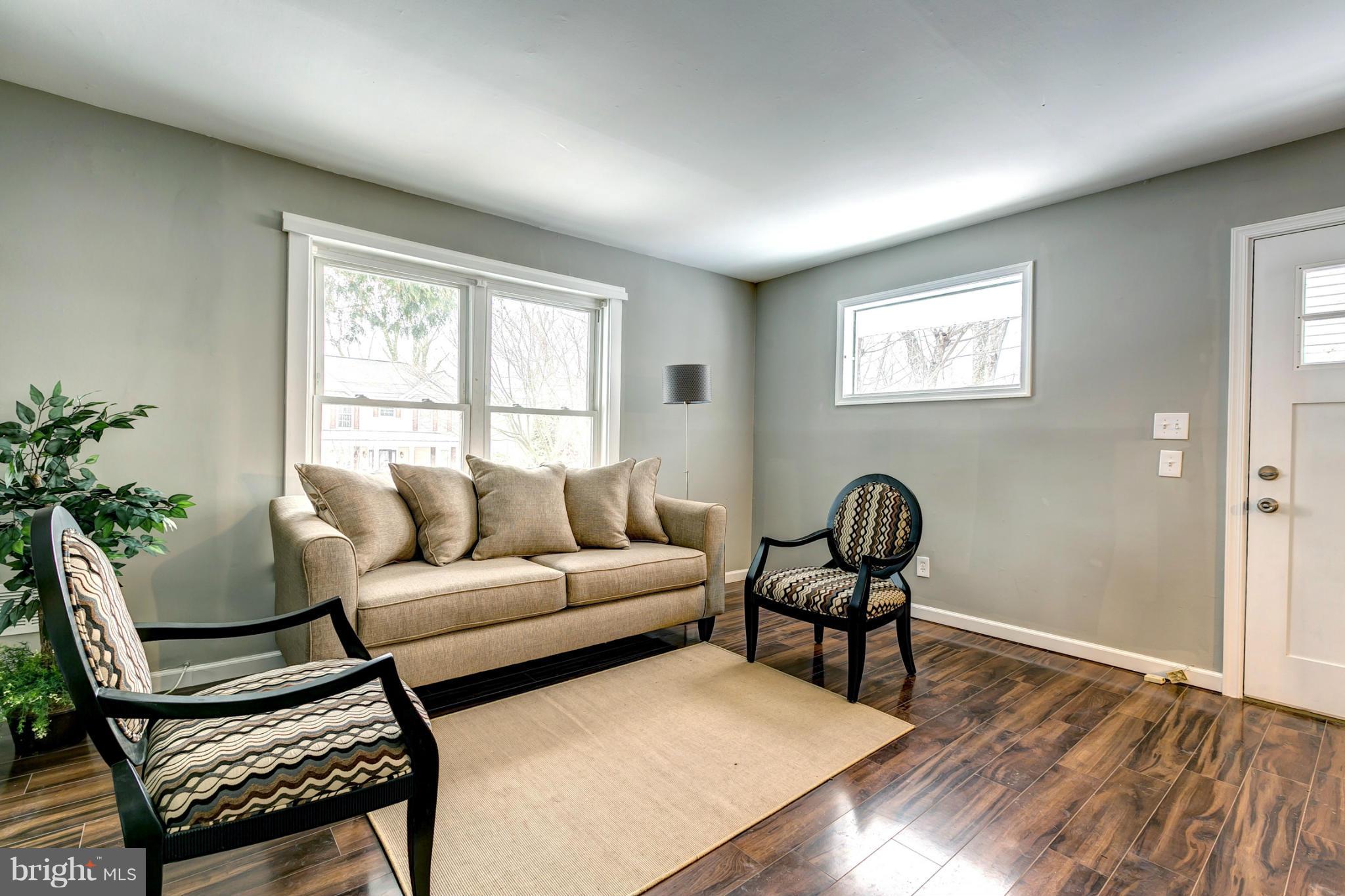 12108 Bluhill Road Silver Spring, MD 20902 - Photo 3 of 30 a living room with furniture and a window