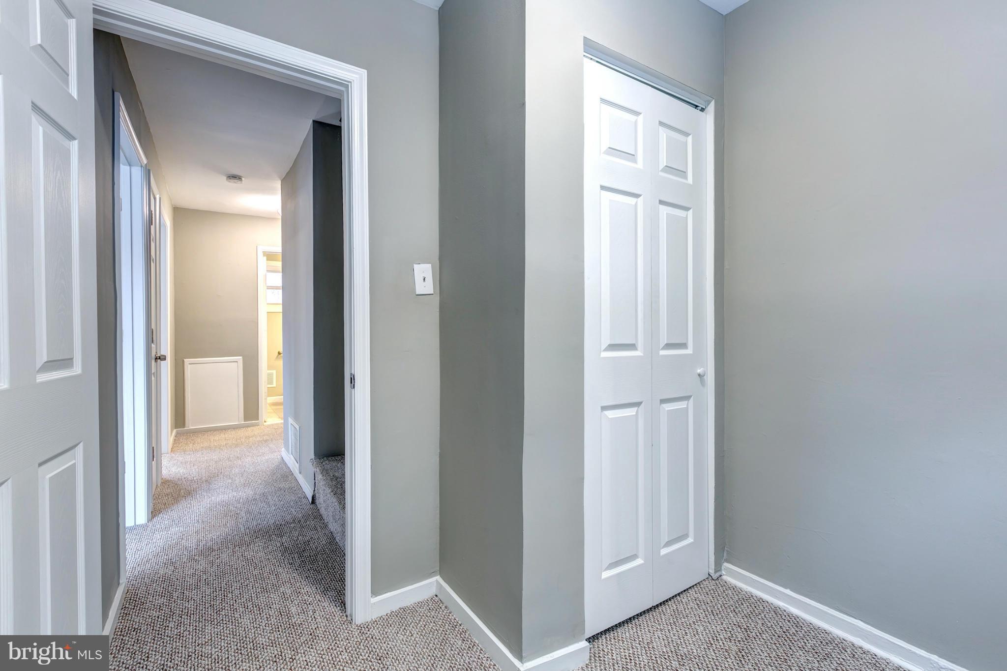 12108 Bluhill Road Silver Spring, MD 20902 - Photo 24 of 30 a view of a hallway with wooden floor