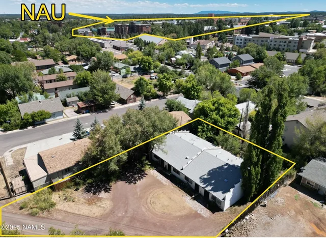 a view of a balcony with wooden benches
