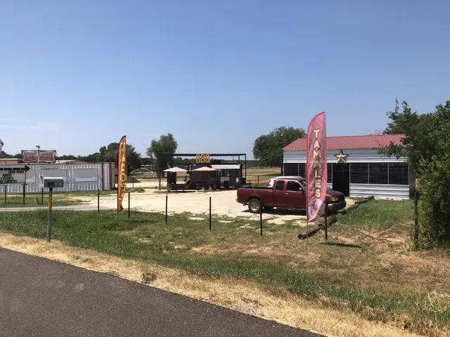 an outdoor space with patio lots of furniture and umbrella