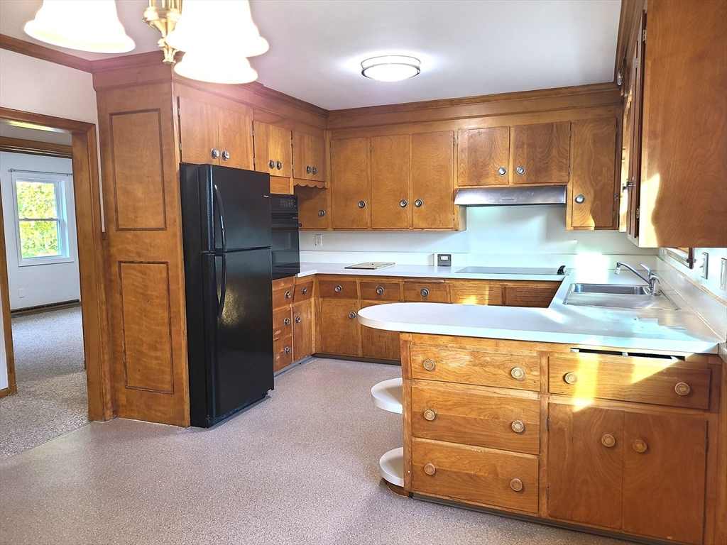 159 Lake Street, Unit 1 Weymouth, MA 02189 - Photo 9 of 21 a kitchen with stainless steel appliances granite countertop a refrigerator a sink and a stove