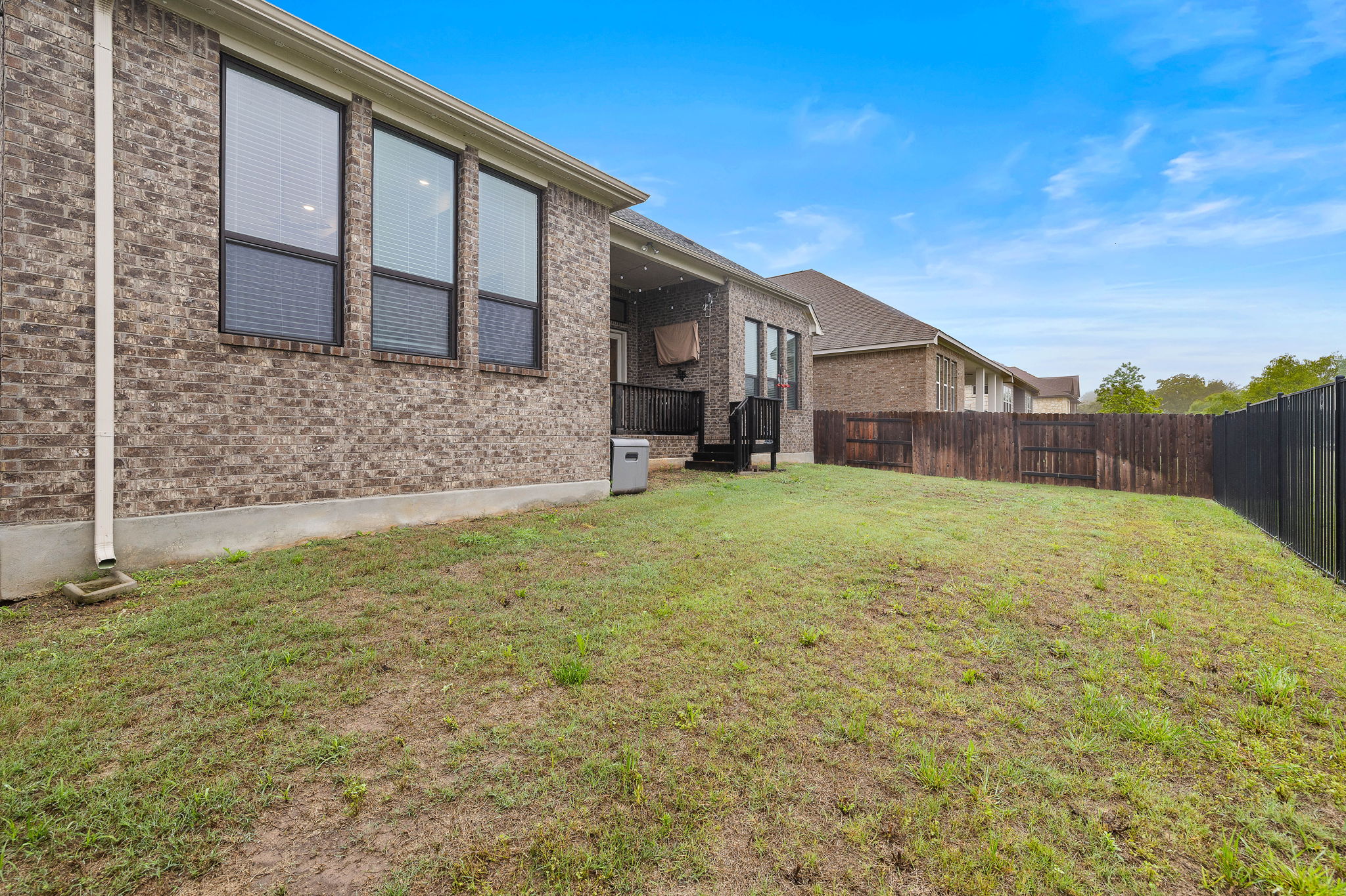 181 Constitution Way Kyle, TX 78640 - Photo 30 of 32 a view of a house with a yard