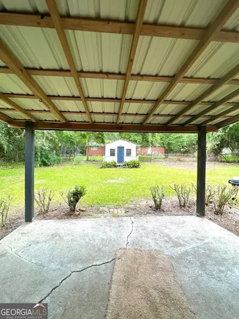 a view of a backyard with a swimming pool