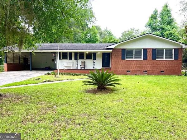 a front view of a house with a yard and porch
