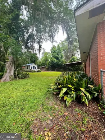 a backyard of a house with lots of green space